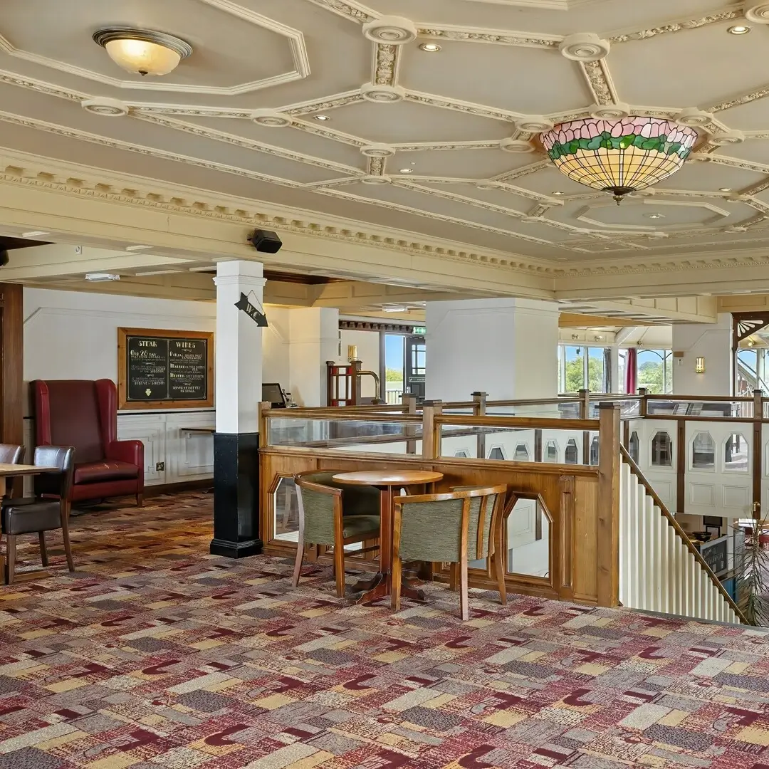 Elegant café interior featuring ornate ceiling details