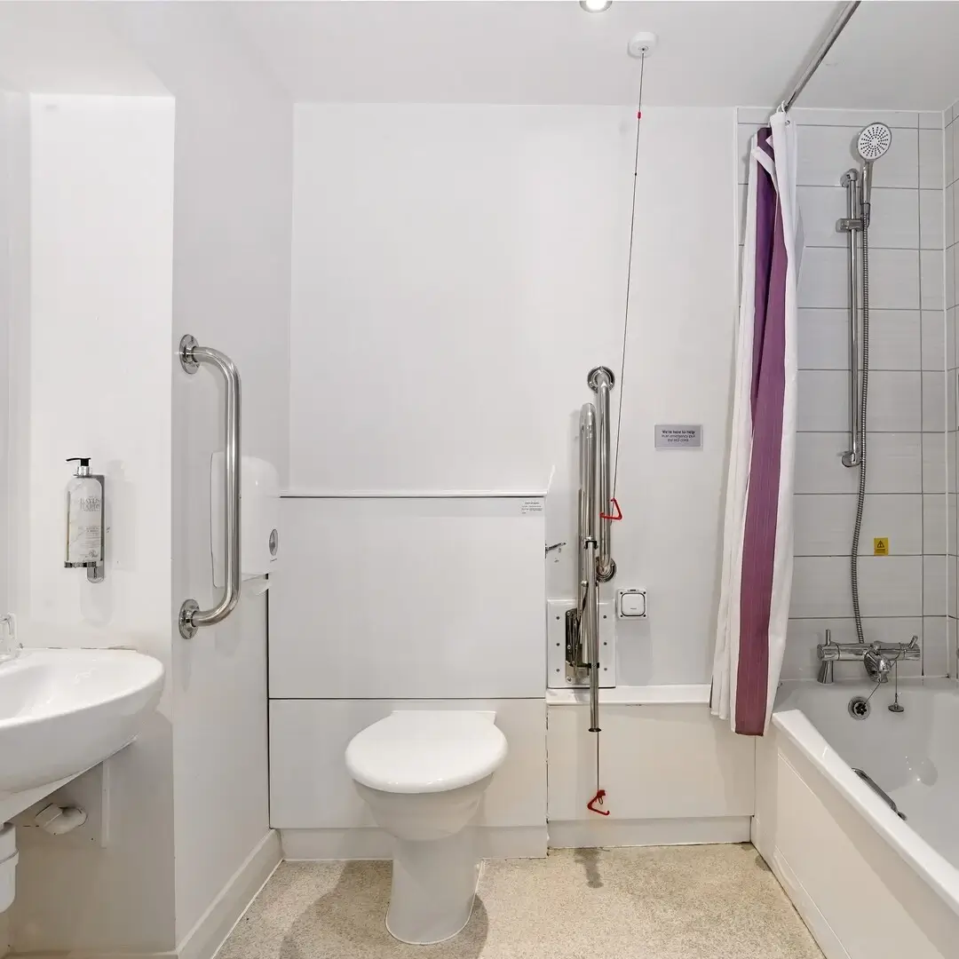 Modern accessible bathroom featuring grab bars